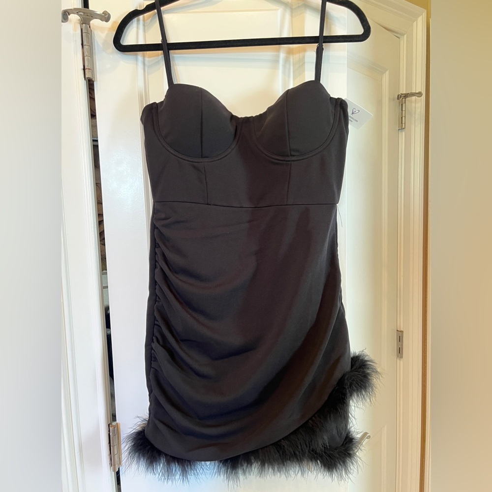 Black, feather hem mini dress.
